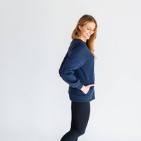 Woman wearing midnight blue warm zipper breastfeeding sweatshirt from maternity store in Canada.