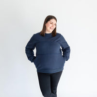 Pregnant woman wearing midnight blue warm zipper breastfeeding sweatshirt from maternity store in Canada (Joyleta).