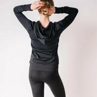 Mother showing back of black nursing hoodie from Joyleta maternity store Canada.