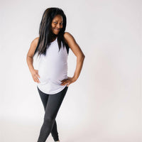 Woman wearing long maternity tank top in lavender.