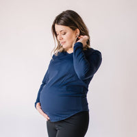 Pregnant woman wearing maternity long sleeve shirt in midnight blue from Joyleta.